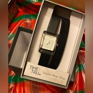 Watch with black wrap around wrist strap. New with tags!